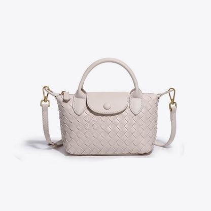 Athena - Kompakt crossbody-taske med vævet tekstur